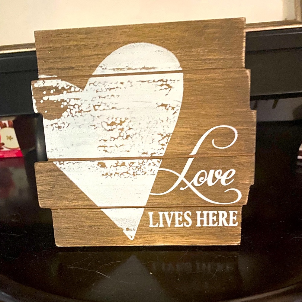 Loves lives here plaque